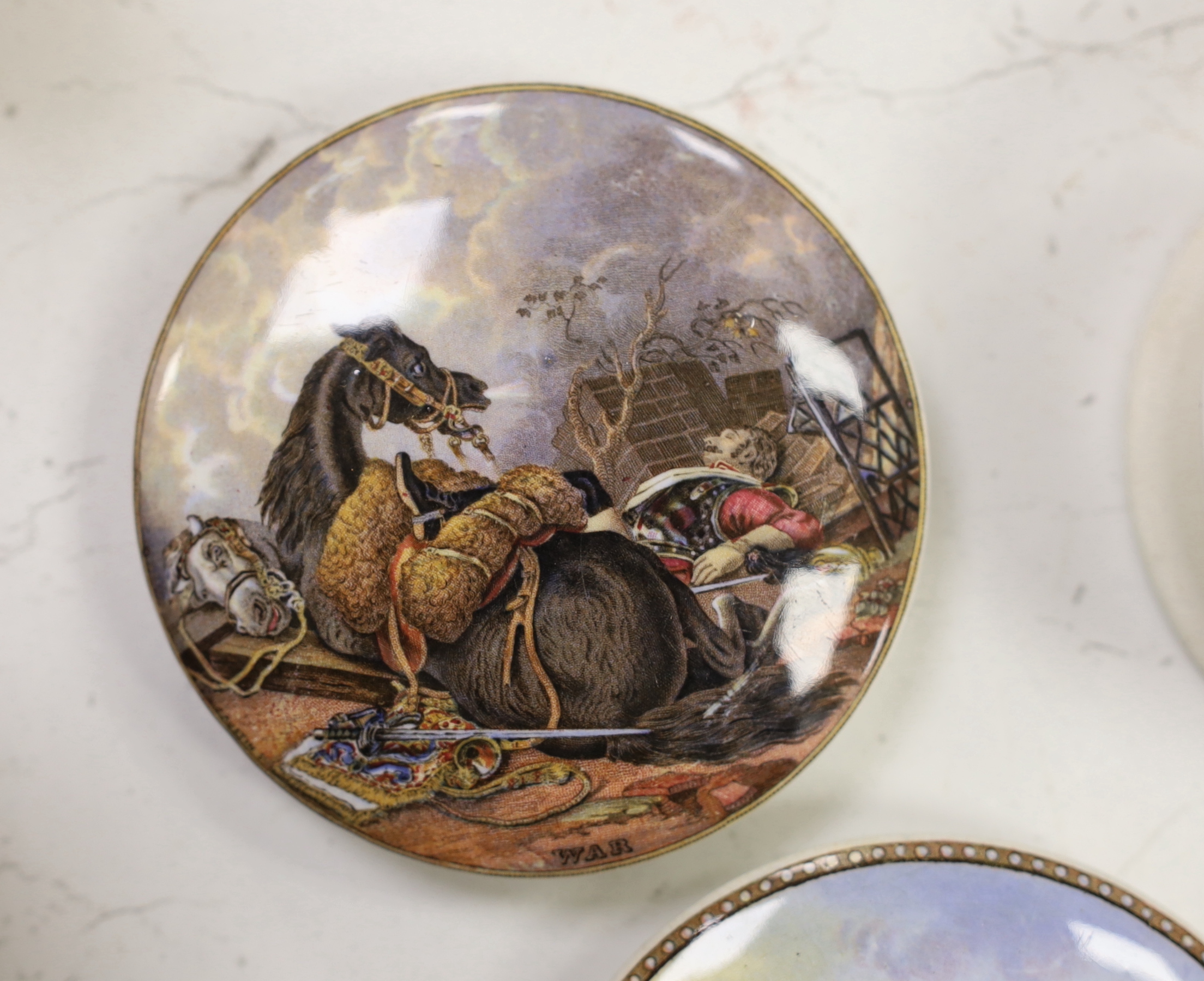 Seven various pot lids, The Cavalier, with base, War and five others